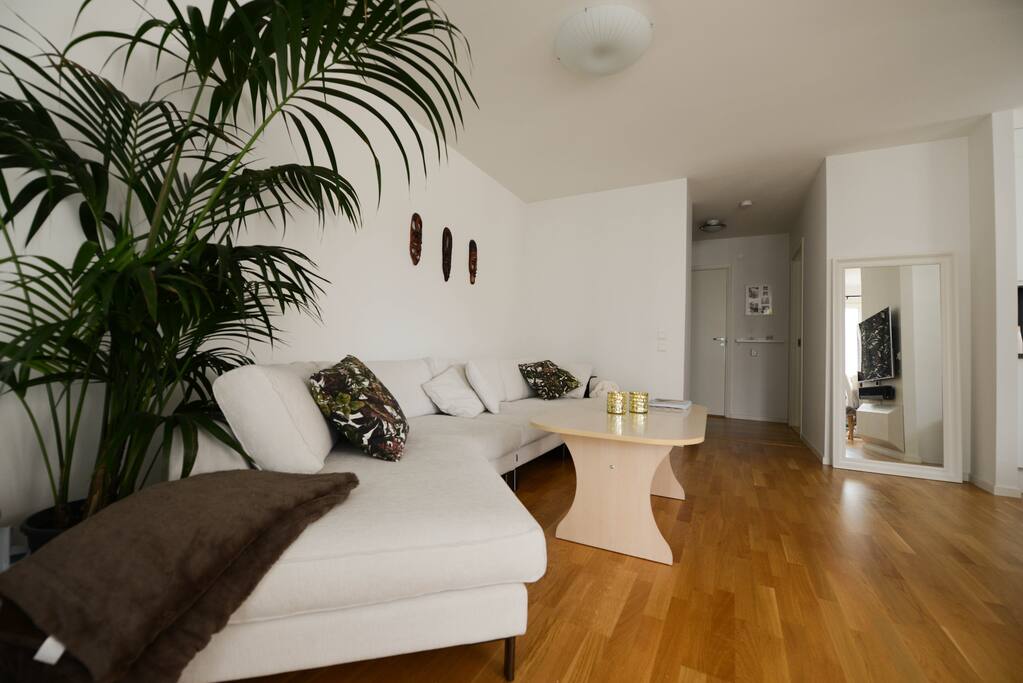 Living room with large sofa and TV.