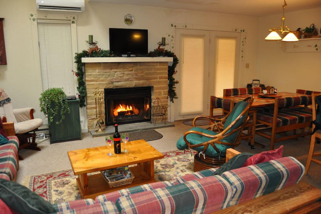 LR with wood burning fireplace and flatscreen tv