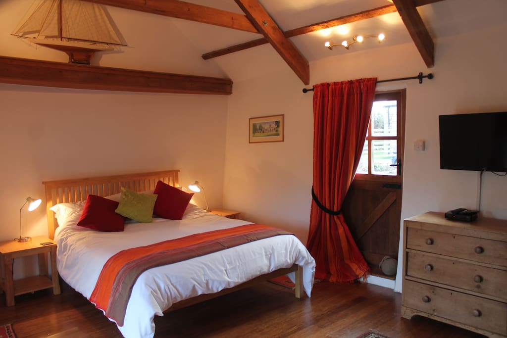 Sleep in comfort under the high-beamed ceiling.