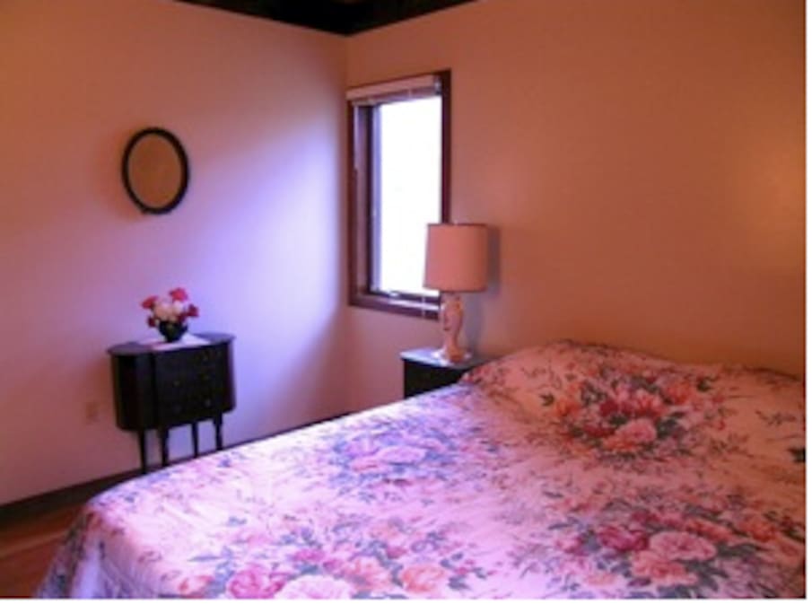 Harmony Room: queen bed, shared bath, AC