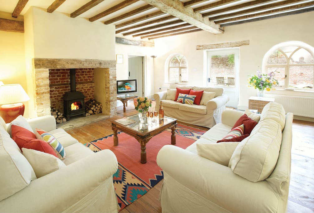 Ground floor: Sitting room with inglenook fireplace and wood burner
