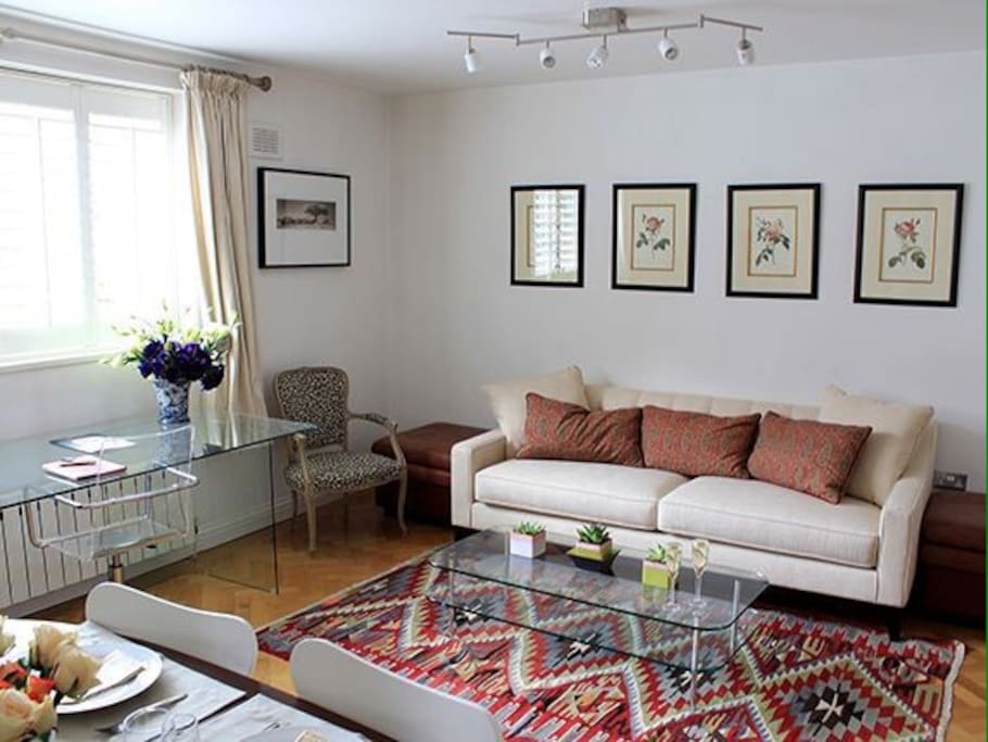 The open plan living space consists of living, dining room and kitchen (to the side)