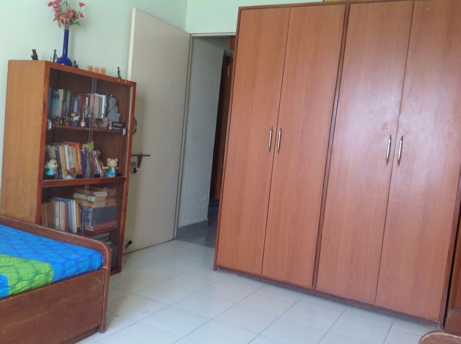 Bedroom with two cupboards with some books too!