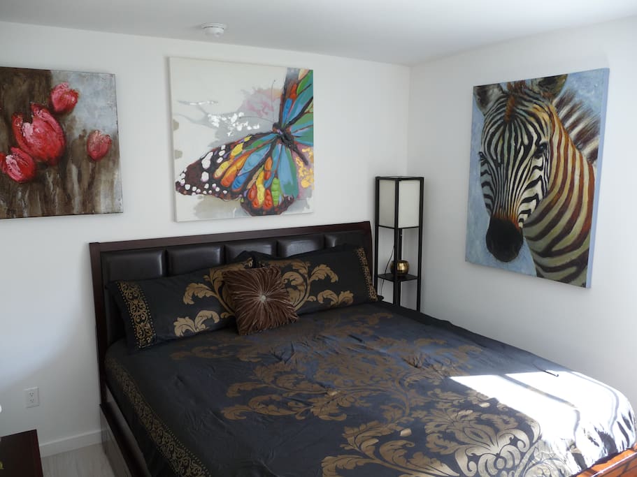 BED AND PAINTINGS