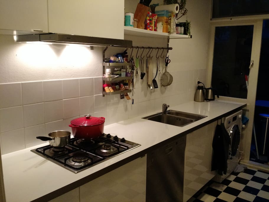Kitchen with everything you might need, dishwasher and washing machine.