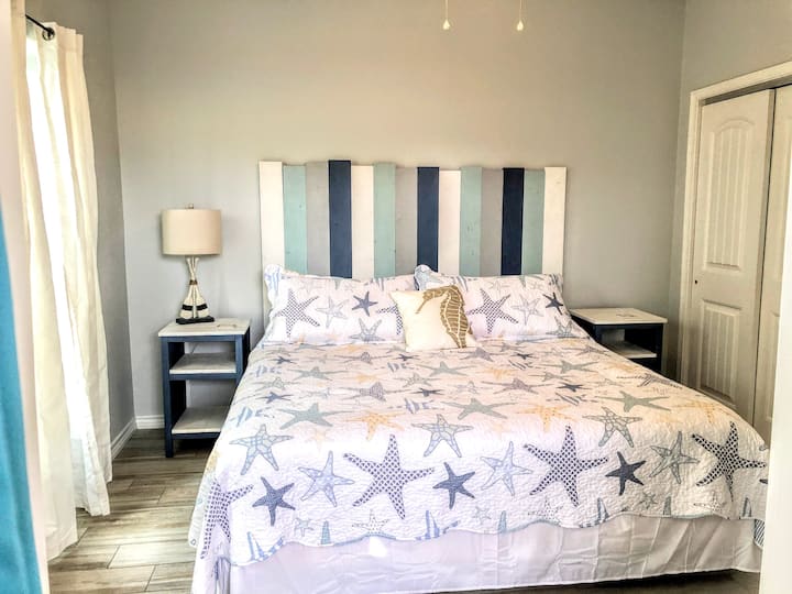 1st level bedroom with king bed