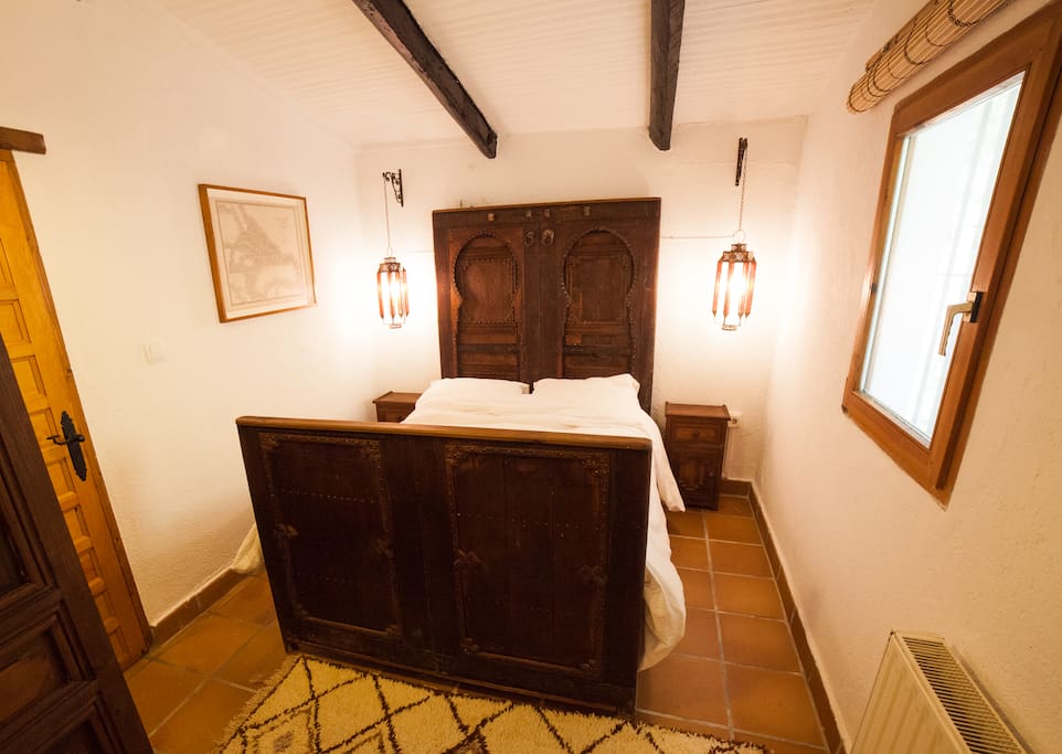 Bedroom two in main house with double bed and en suite bathroom