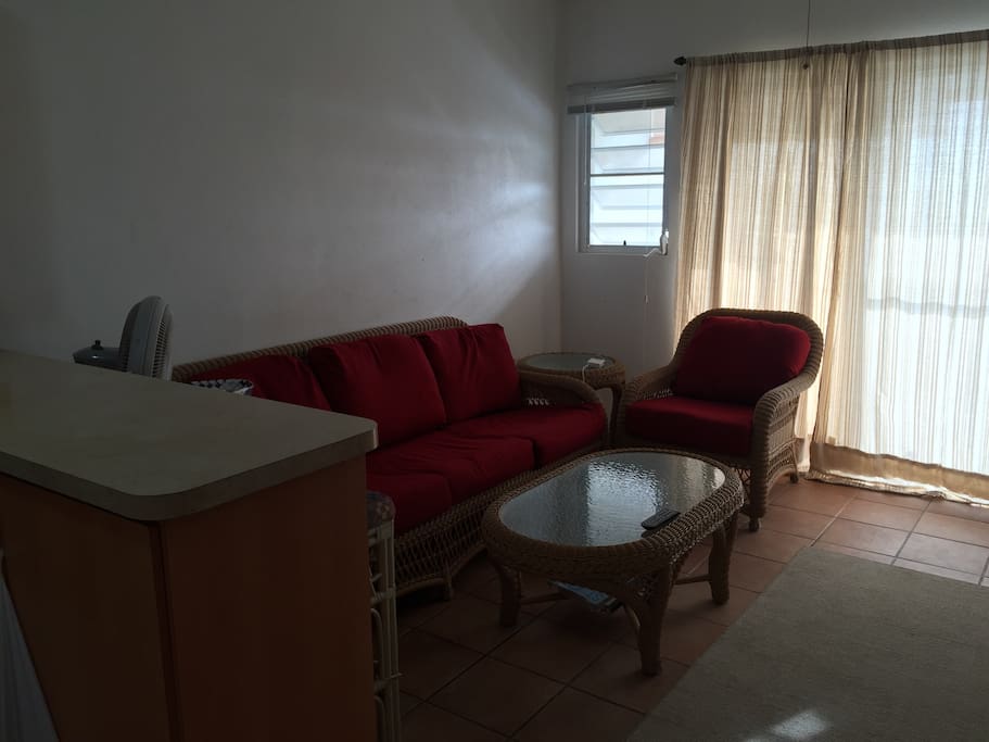 Living room with large TV and access to Apple TV