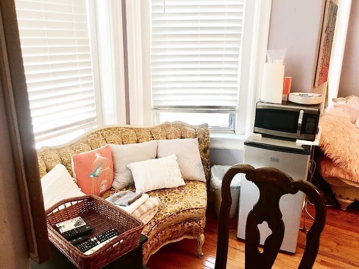 Fridge and Microwave. Your own corner sofa to relax, enjoy your meal, with a desk area for work-space. 