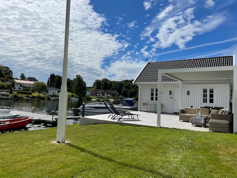 Idyllic cabin by the water with canoe and kayak.