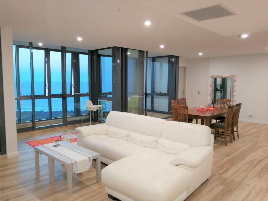 Living Room with amazing view of the Ocean, Marina and all the way to Moreton Island