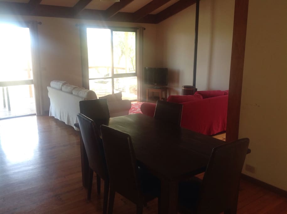 A large open plan living area looks across to ancient escarpment