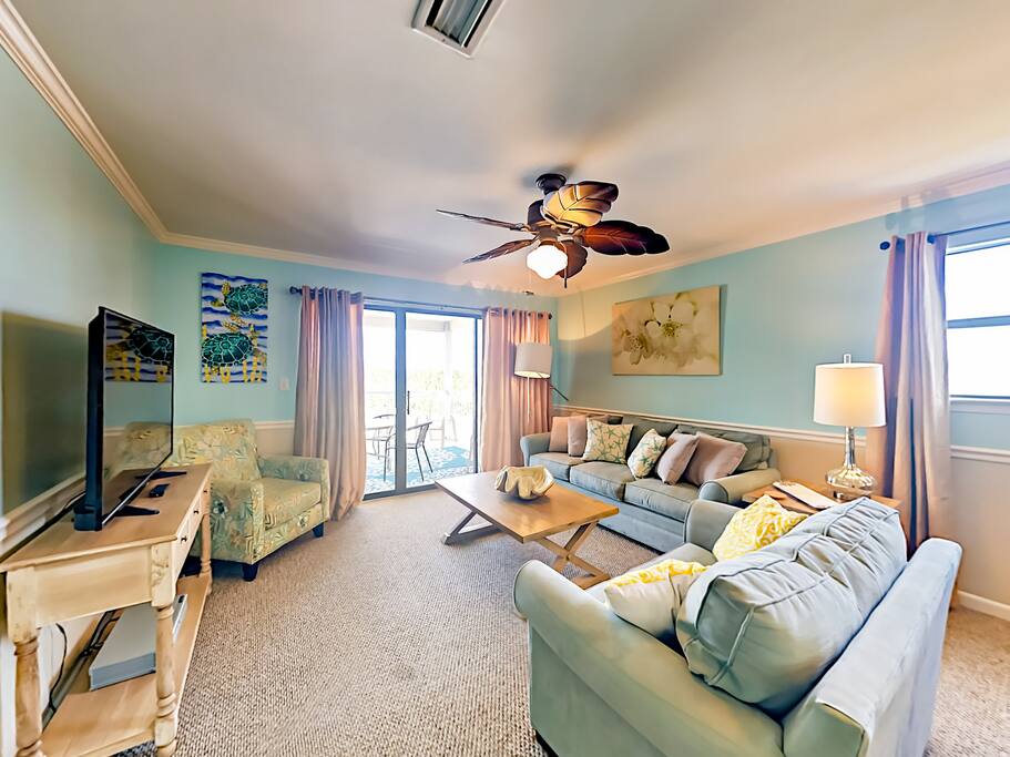 Kick back on a sofa and 2 armchairs in the living room.