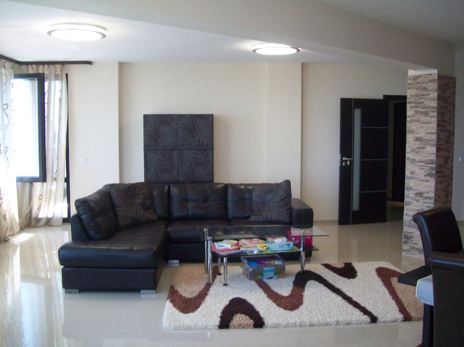 Big dinning room with sofa cum couch to enjoy sea view