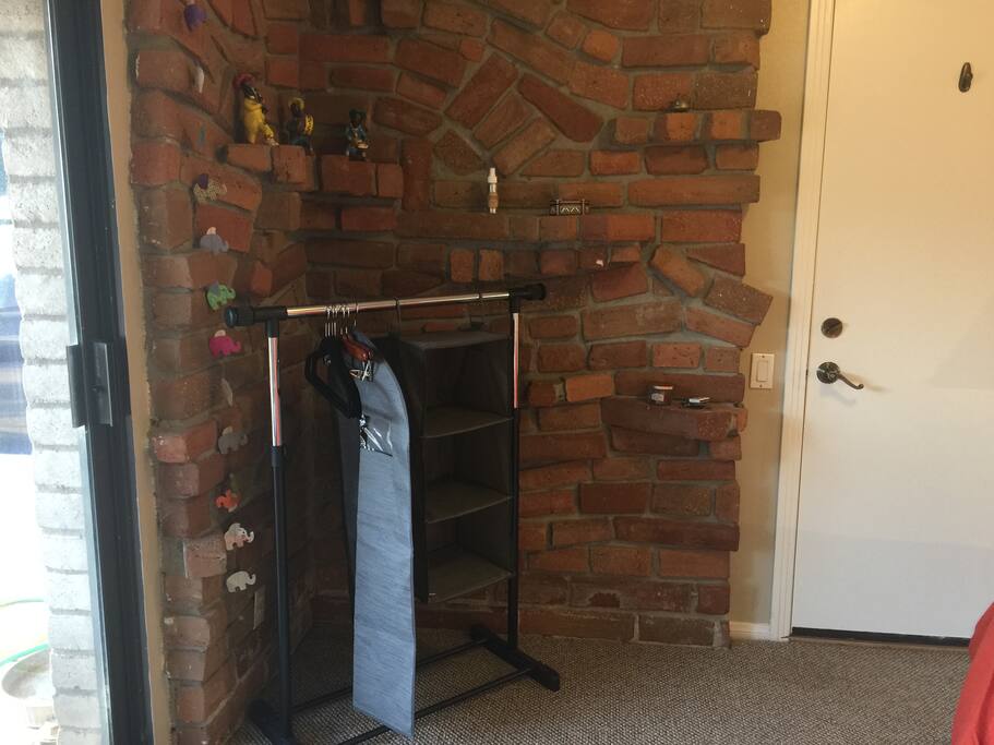 The Queen bedroom clothes area and door to bathroom (across outdoor breezeway)