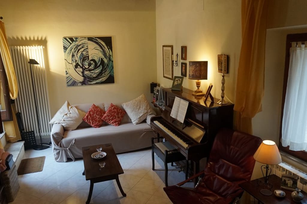 Living Room, sofa bed, coffee table and piano