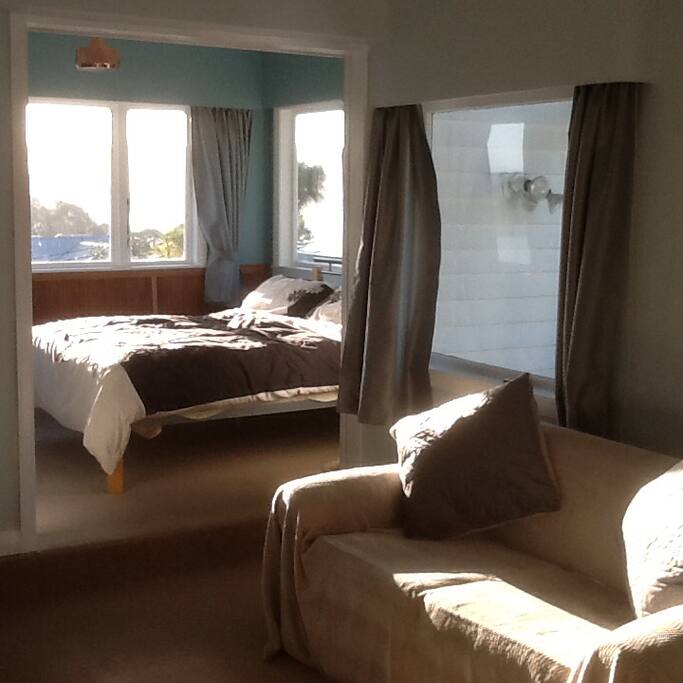 Bedroom with sliding doors open. Harbour views.