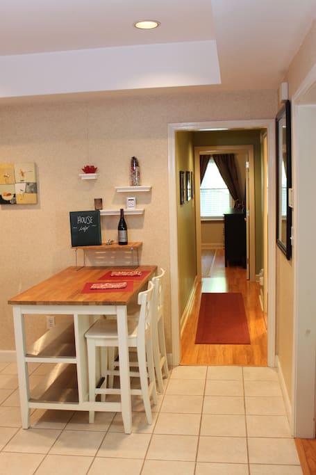 Kitchen table and hallway to guest bathroom and bedrooms