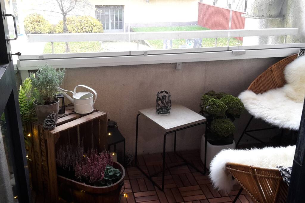 Cozy balcony with glass Windows and infra red heater on the wall.