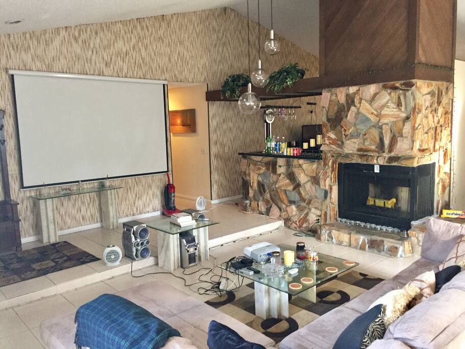 Great Room, 10’ movie projection screen, wetbar, fireplace