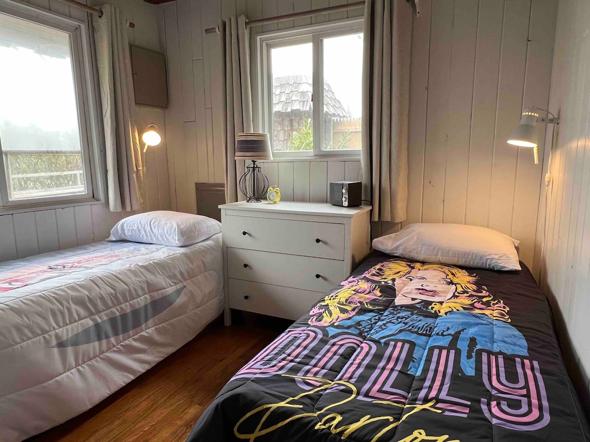 Bedroom (two twins). The comforters are Dolly and Ru Paul