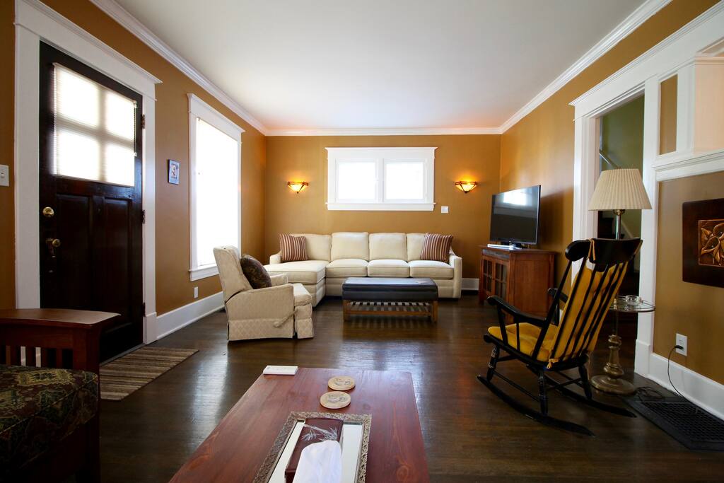 View of the other half of the living room. The "L" shaped sofa is brand new and VERY comfortable. The cushions can be removed to reveal a comfortable queen bed.