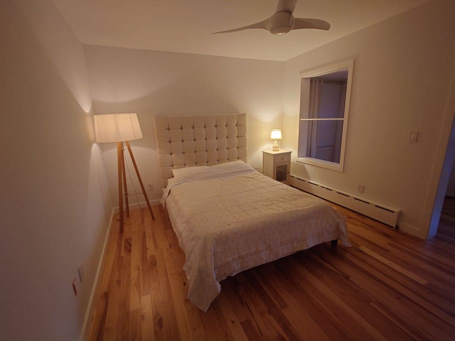 Room with a queen bed.
