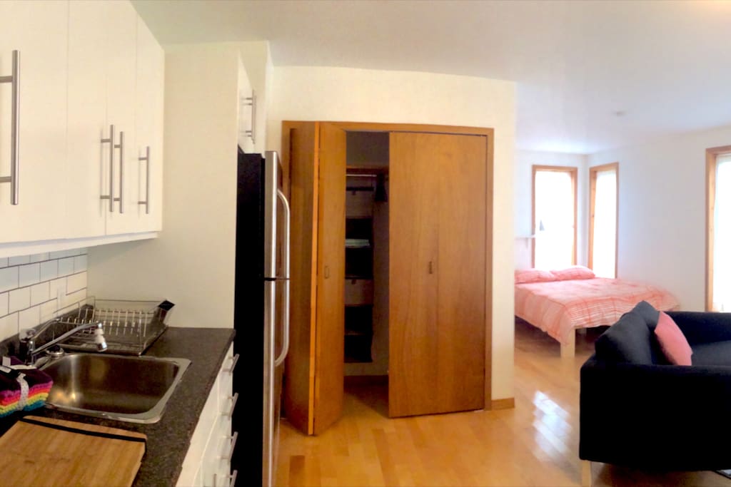 Private entrance with access to back deck in the trees