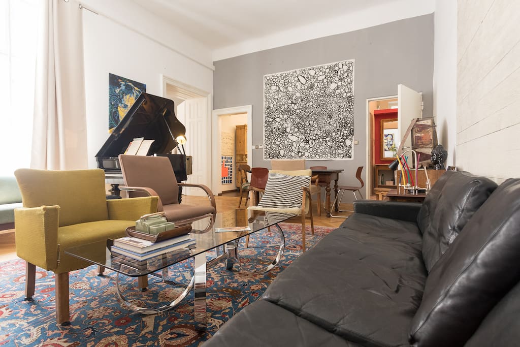 the living room with a grand piano