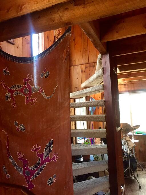 spiral staircase up to sky bedroom