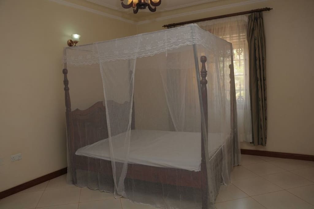 Mosquito net covers the bed fully for your protection and peaceful night