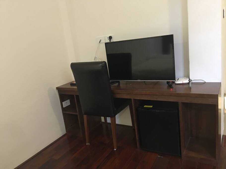 Desk, fridge and free cable TV