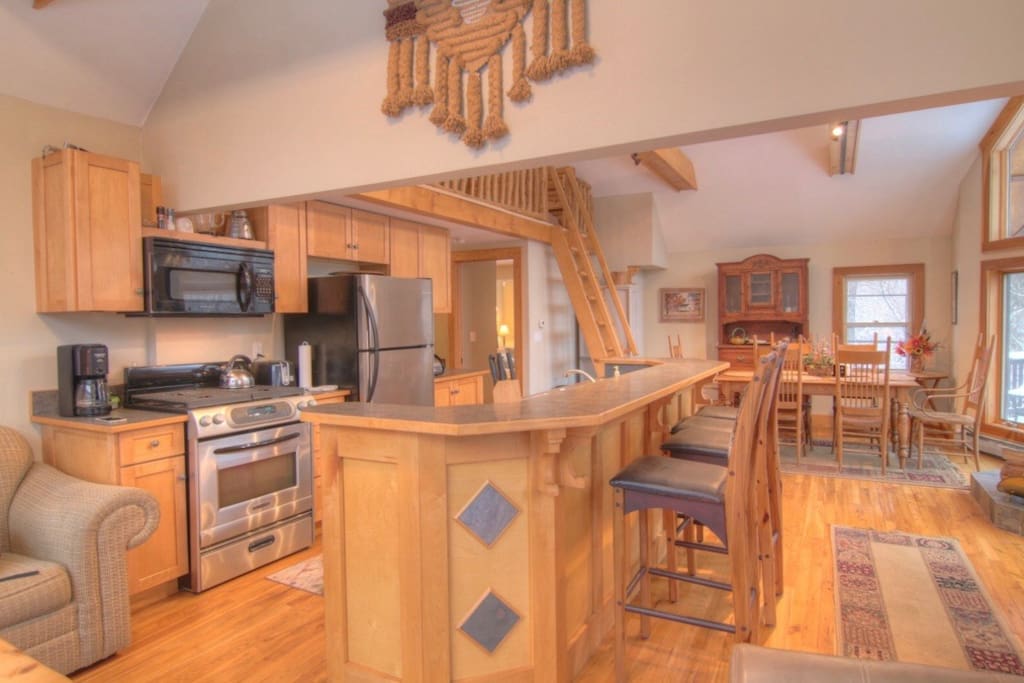 This fully equipped kitchen comes with outstanding views of the surrounding woods.