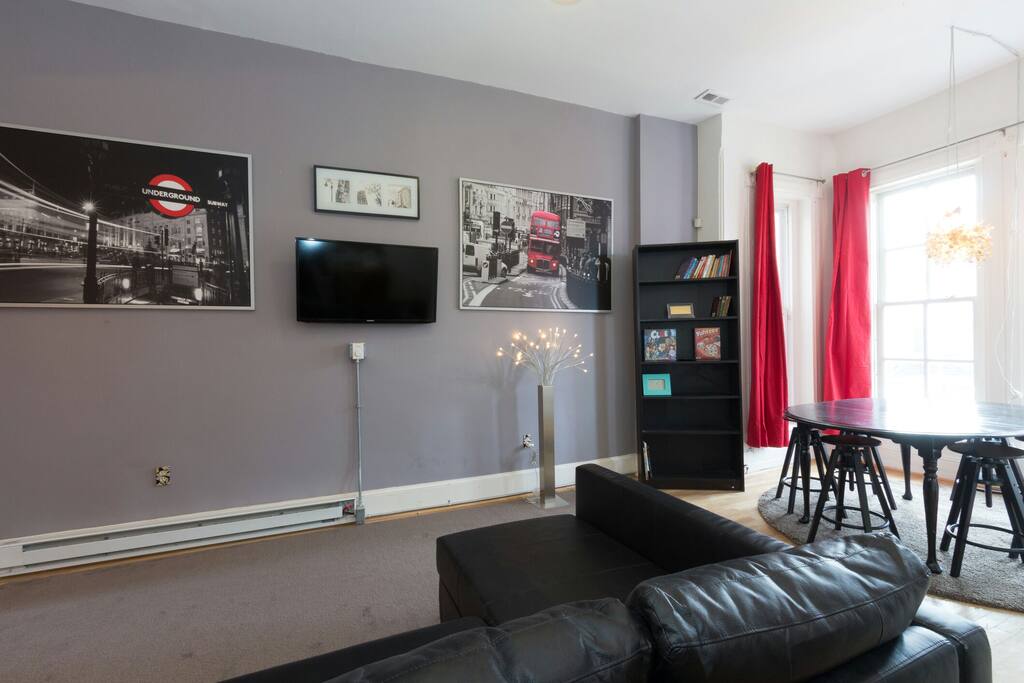 Living room. 40" mounted Smart TV with sleeper sofa.