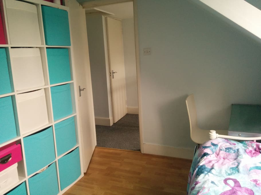You have a small desk with a chair and your room leads out onto a hallway shared with the small bathroom (loo and basin only) and the main bedroom. The rest of the rooms are one floor down.