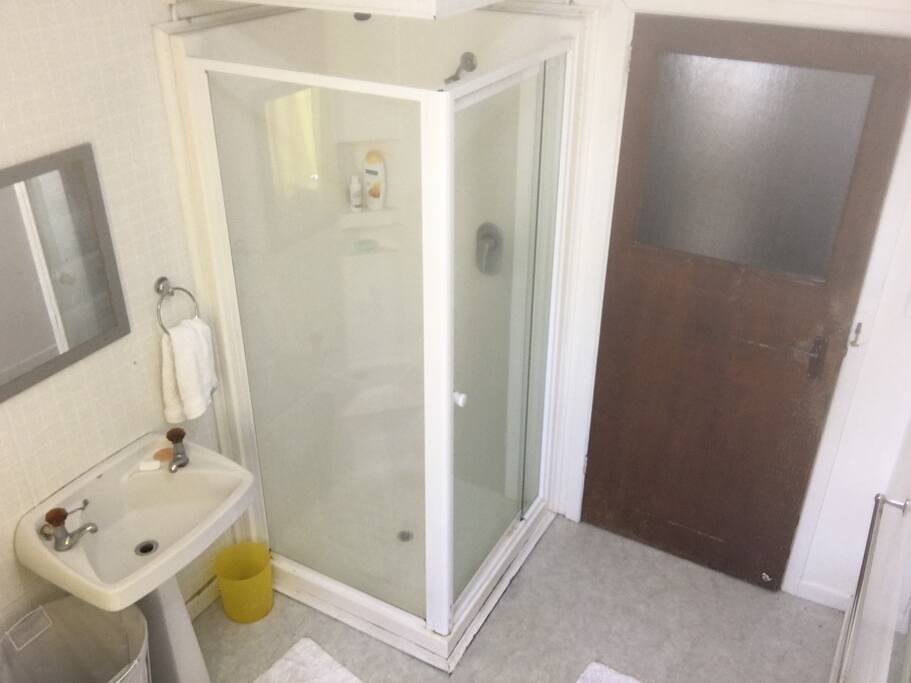 Bathroom with shower and bath