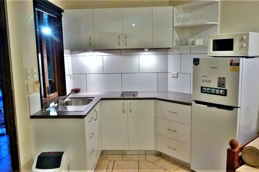 New kitchen with full size fridge and lots of bench space