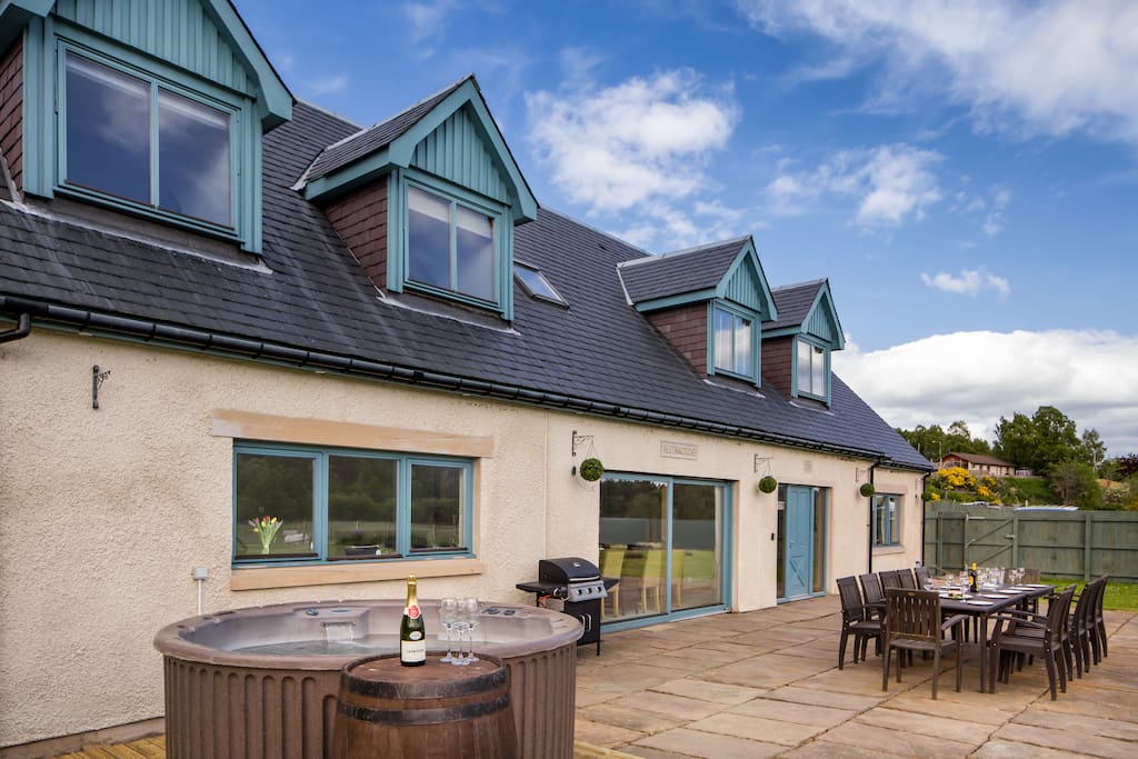 Wonderful outdoor space with hot tub, outdoor seating and a very large garden.