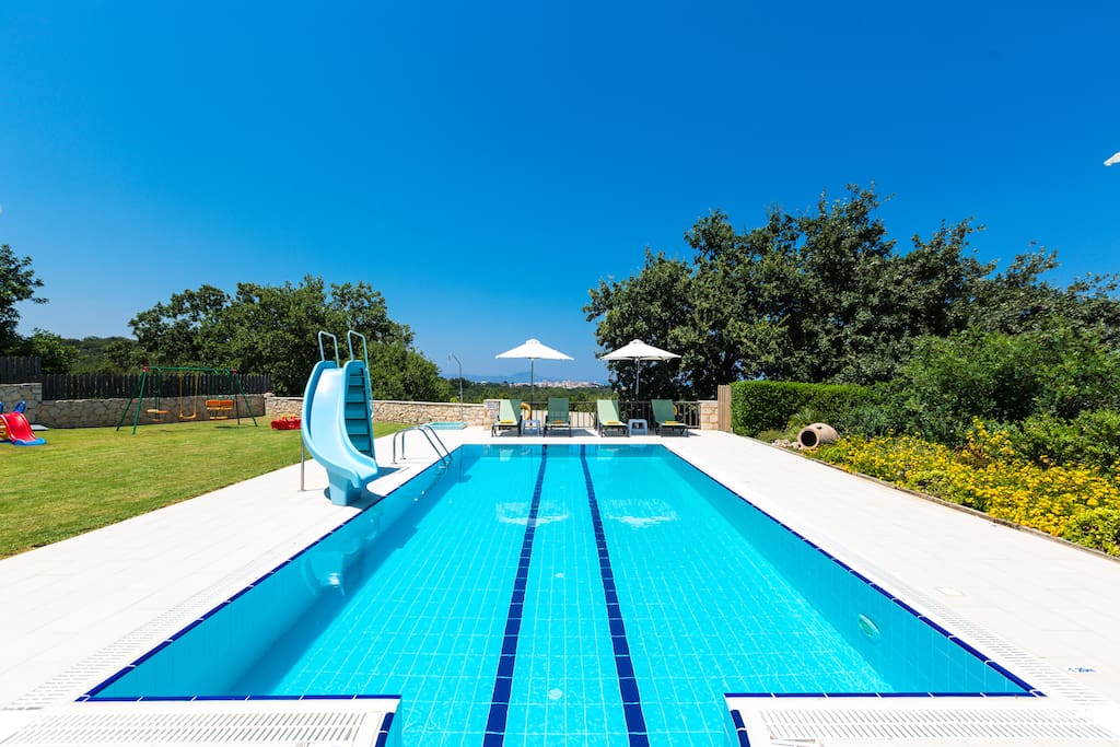 Swimming pool area with sun beds pool alarm system for children's