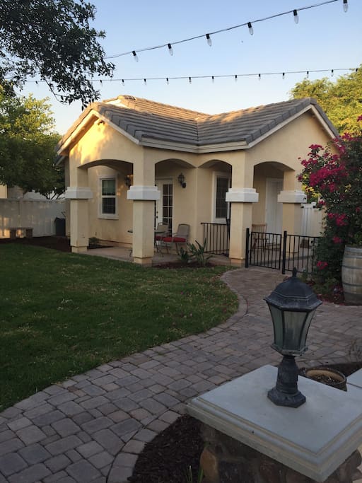 Guesthouse has private entrance up the drive way through its private patio.