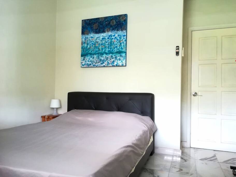 The room has air-cond, fan, queen-size bed, a study table and a chair, a clothes hanger and a big window with view over the jungle