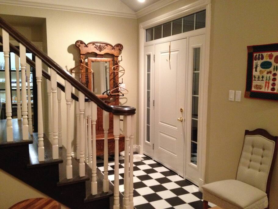 Entrance with stairs to upstairs guest suite