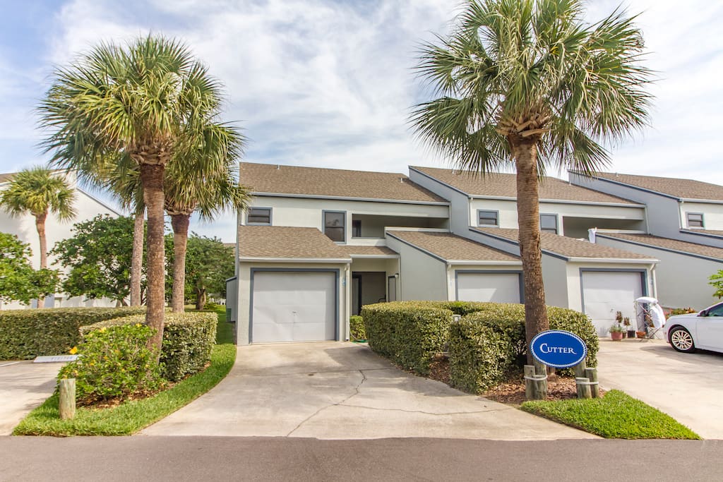 Front of Condo with a (1) Car Garage