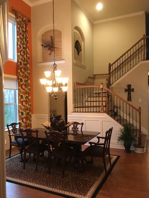 Formal dining opens up to other living areas