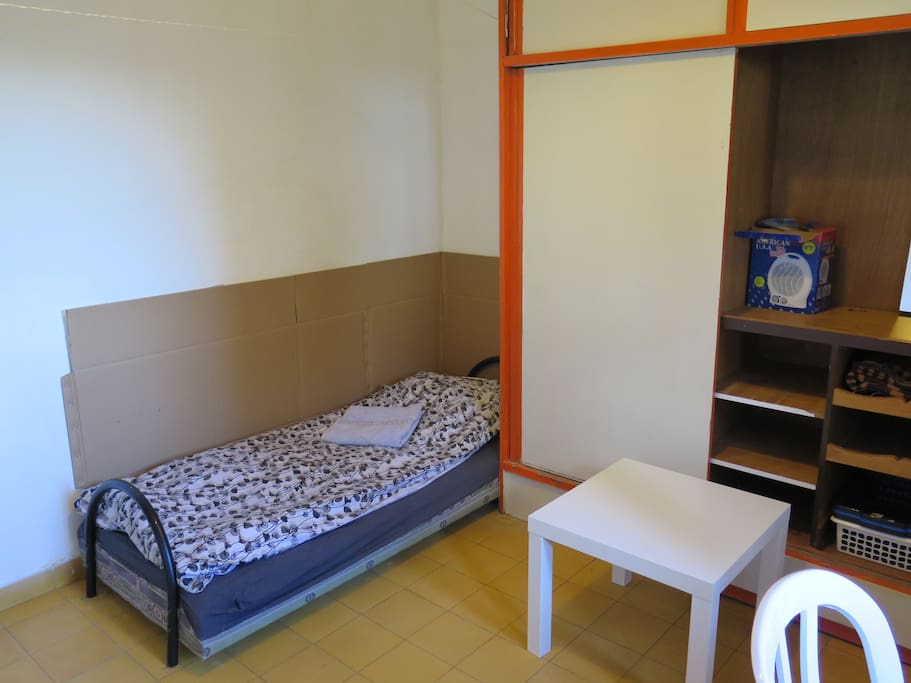 Your room - the bed (with thermal isolation from cold walls), huge wardrobe for all your things, the dining / bedside table