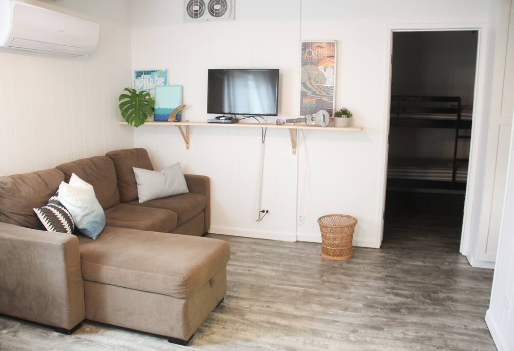 living room, entrance to bunk room on the right