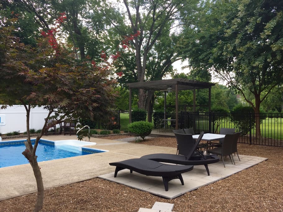 Ample options for lounging surrounded by beautiful maple and crepe myrtle trees.