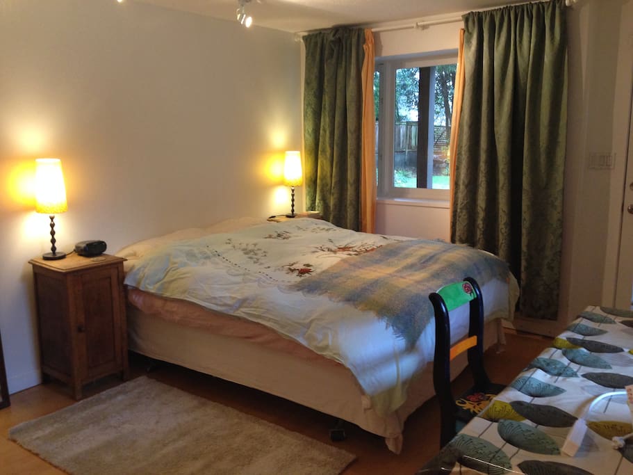 Spacious double bedroom with south and east facing windows onto gardens