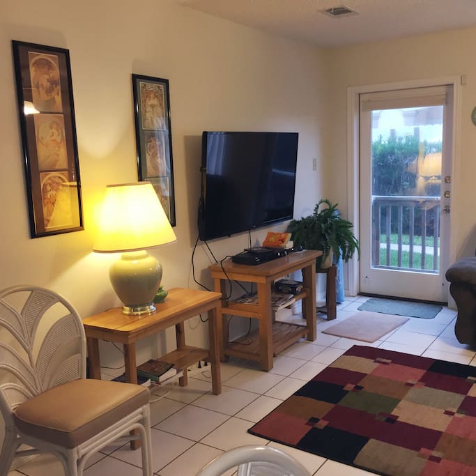 Another view of the living room. The door leads to the back yard and access to the pool.