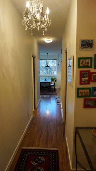 Hallway entrance with some art and family photos.